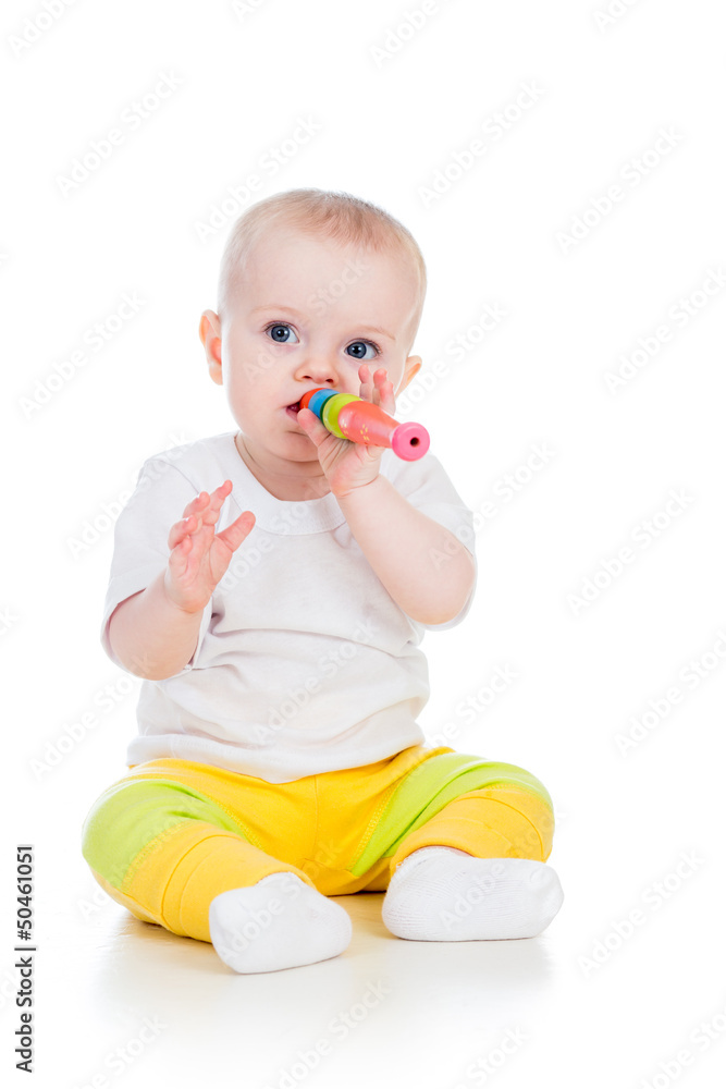 baby girl playing with musical toy isolated on white baby girl playing with musical toy isolated on white