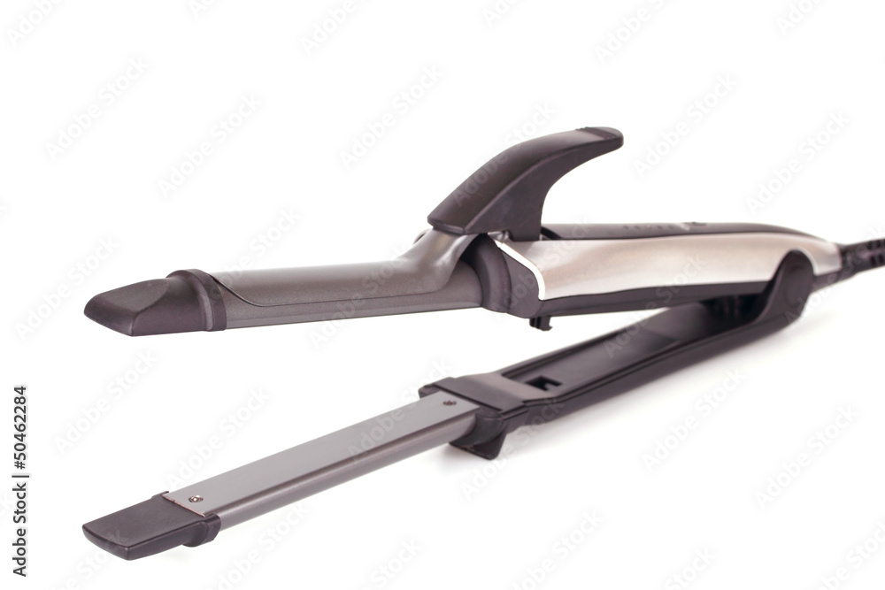 a straightening iron on a white background a straightening iron on a white background