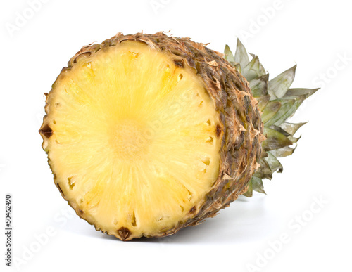 Juicy pineapple and slices isolated on white background
