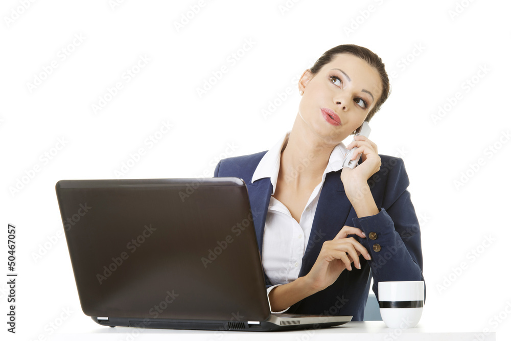 Smiling young business woman speaking on phone Smiling young business woman speaking on phone