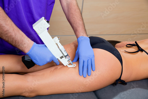 mesotherapy gun therapy for cellulite doctor with woman photo