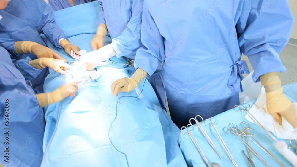 Specialized Team Performing Surgery in Operating Room Specialized Team Performing Surgery in Operating Room