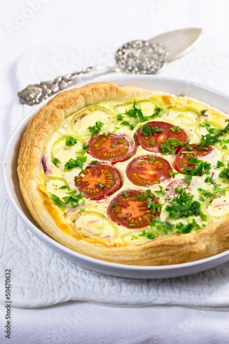 Vegetable pie with tomatoes, onions and herbs