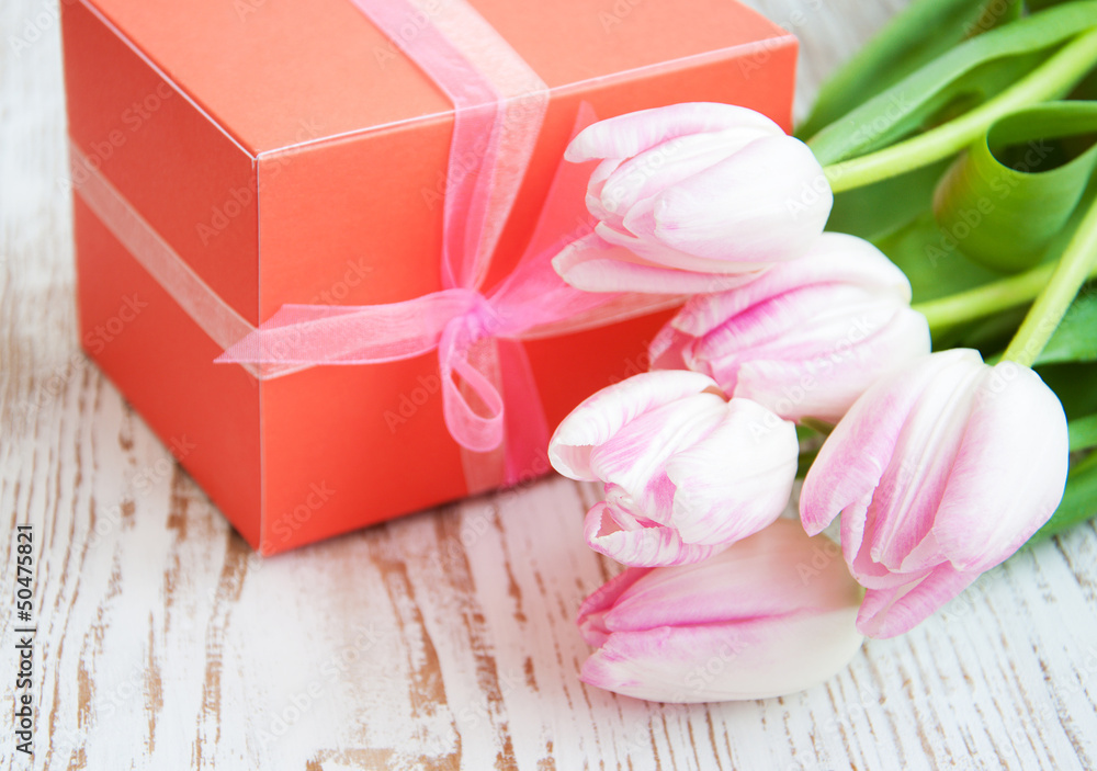 bouquet of tulips, gift box on a table bouquet of tulips, gift box on a table