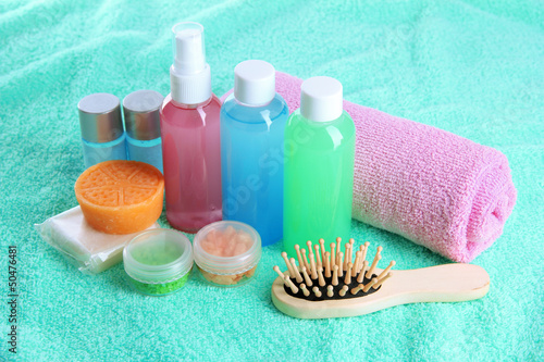 Hotel cosmetics kit on blue towel