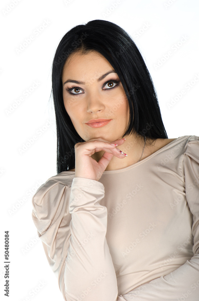 Beautiful brunette with one hand to her chin Beautiful brunette with one hand to her chin