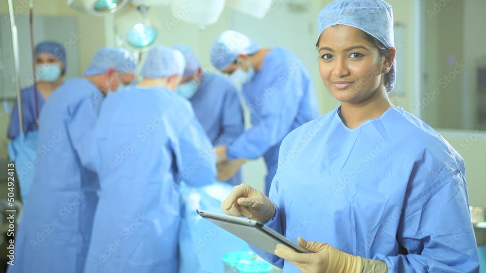 Portrait Female Nurse Wireless Tablet Foreground Operating Room Portrait Female Nurse Wireless Tablet Foreground Operating Room