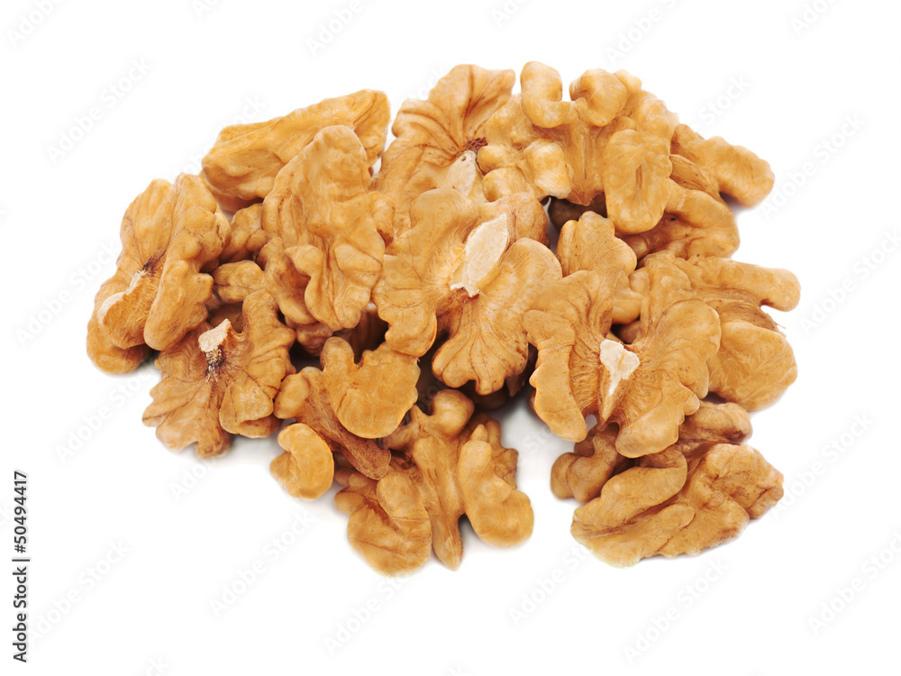 Heap of fresh shelled walnuts on white background. Close-up. Heap of fresh shelled walnuts on white background. Close-up.