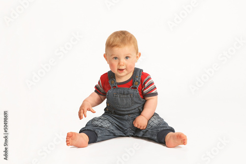 Cute baby sitting on white background
