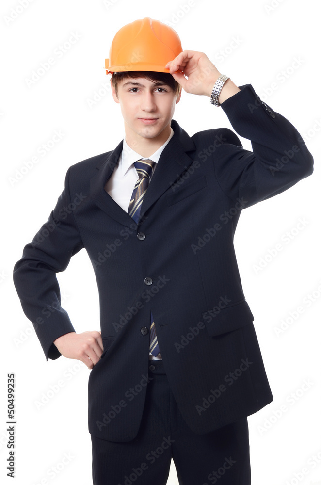 The businessman in a business suit and building helmet The businessman in a business suit and building helmet