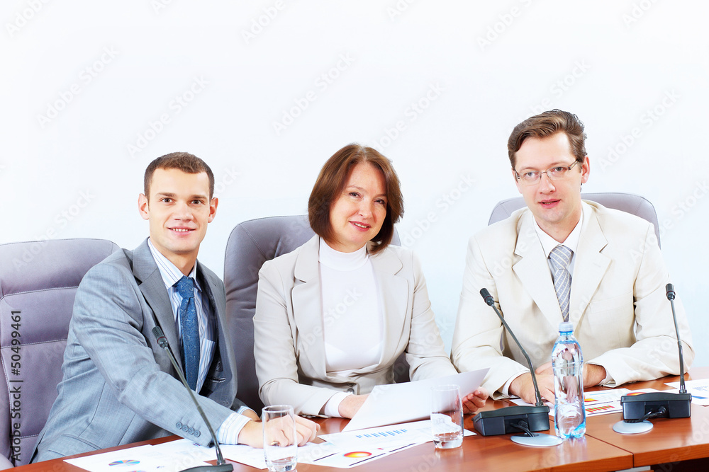Three businesspeople at meeting Three businesspeople at meeting