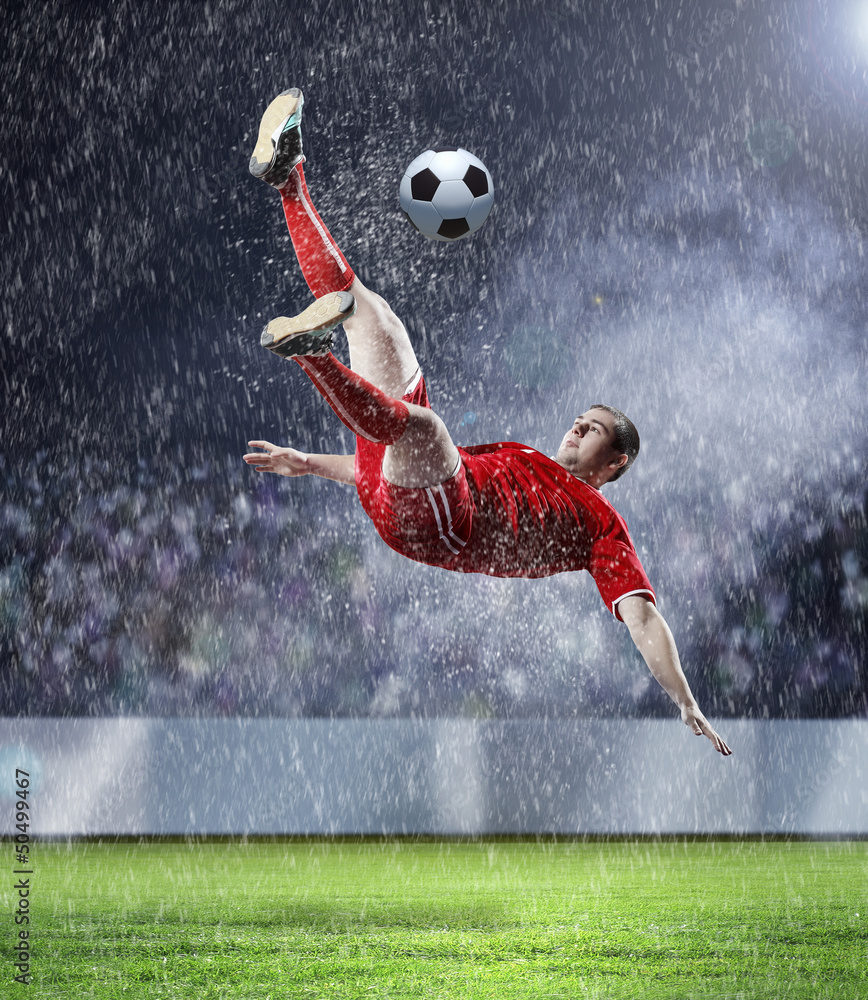 football player striking the ball football player striking the ball