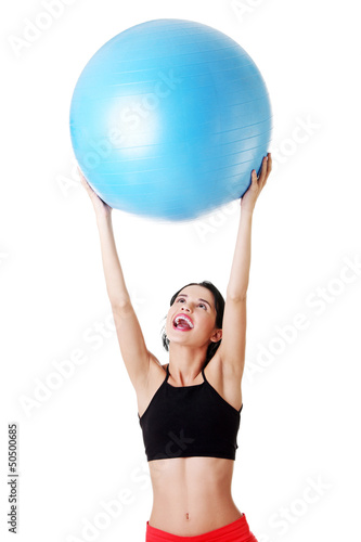 Woman with pilates exercise ball.