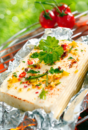Halloumi cheese grilling in tin foil