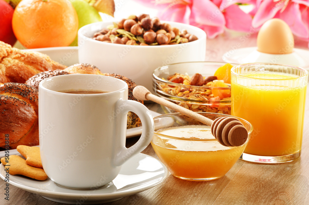 Breakfast including coffee, bread, honey, orange juice, muesli a Breakfast including coffee, bread, honey, orange juice, muesli a