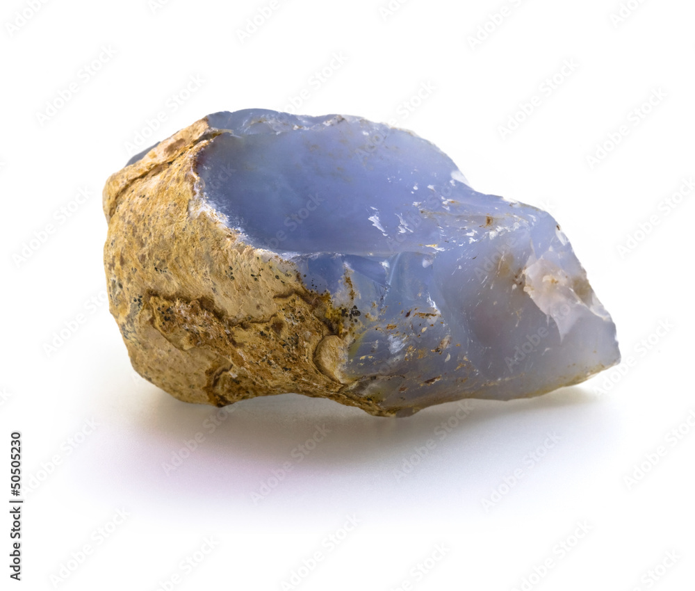 Raw natural blue chalcedony rock isolated on white