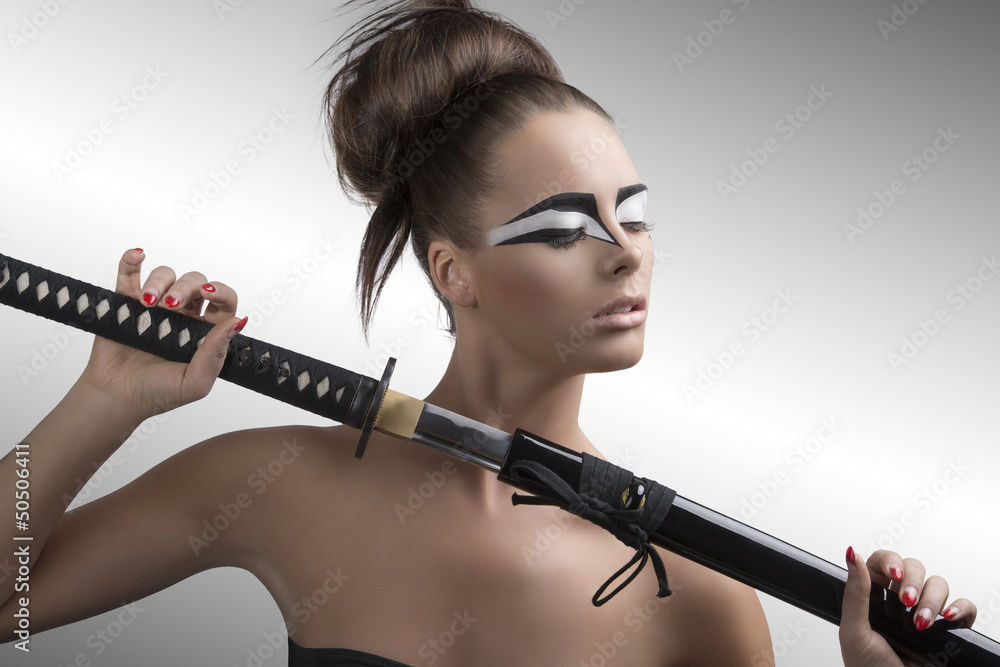 brunette in japan style with katana and closed eyes brunette in japan style with katana and closed eyes