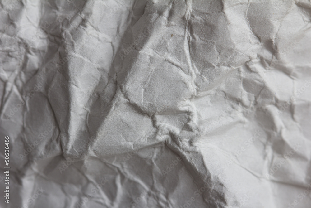 Fototapeta premium crumpled white paper as a background