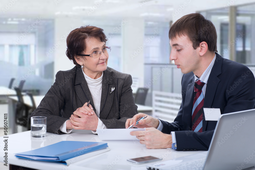 Elderly woman with a financial advisor Elderly woman with a financial advisor