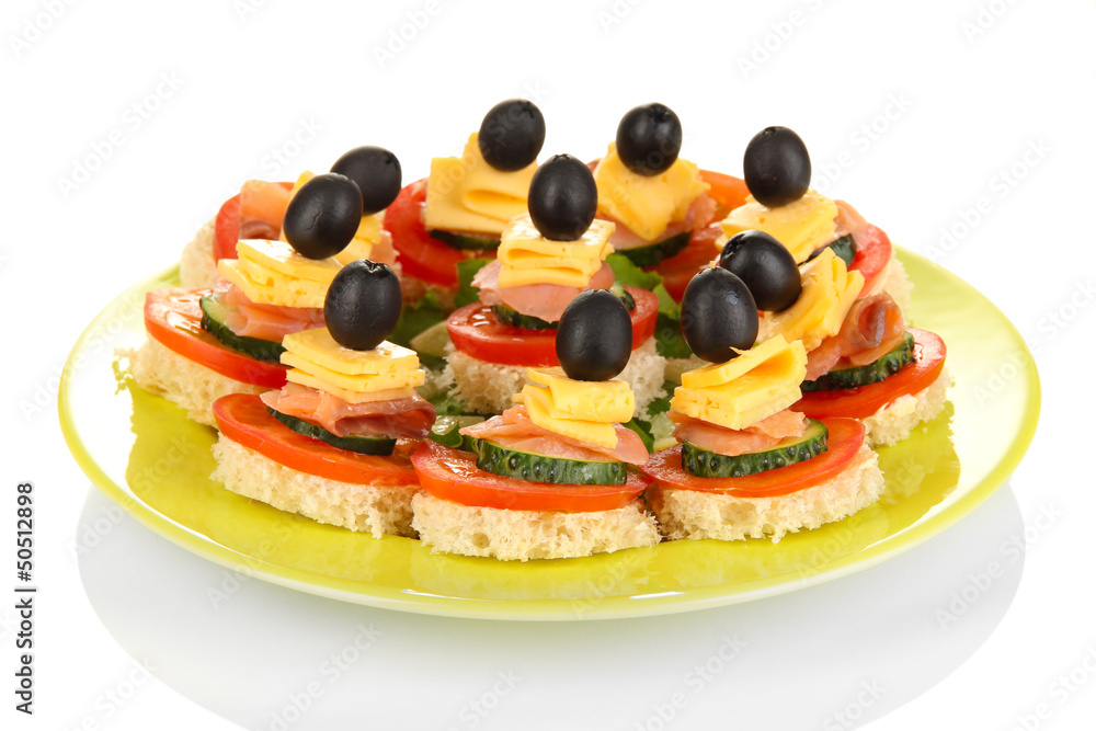 Canapes on plate isolated on white Canapes on plate isolated on white