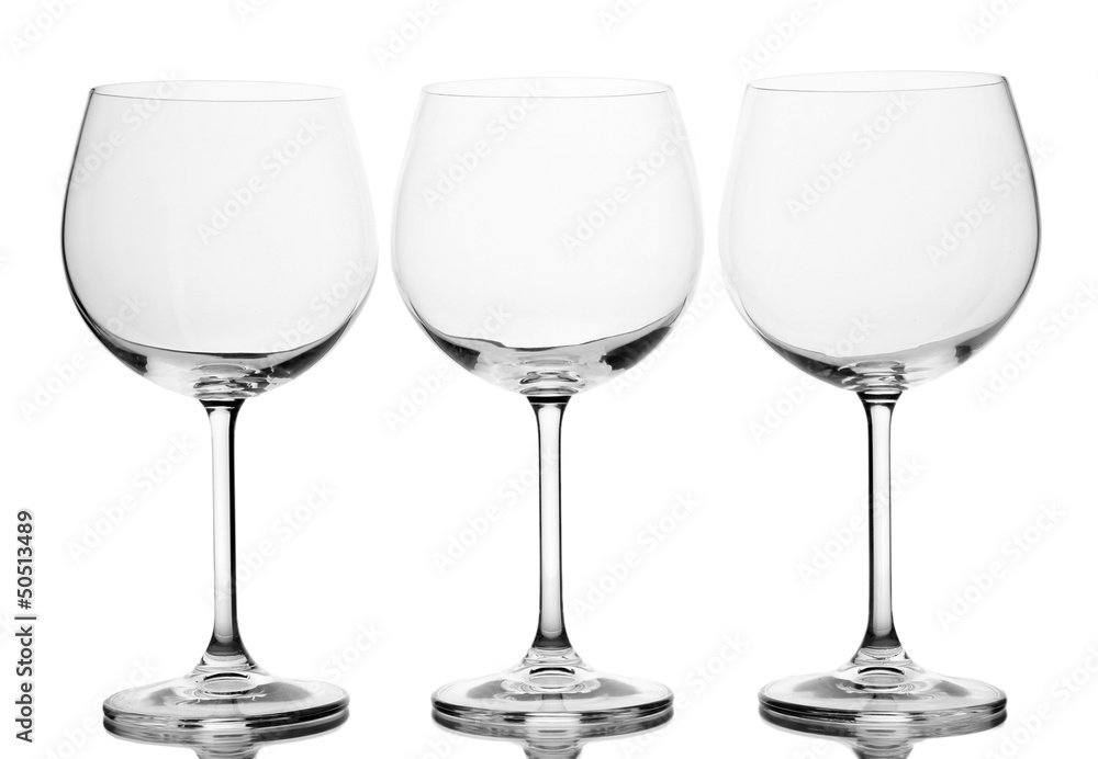 Empty wine glasses arranged and isolated on white