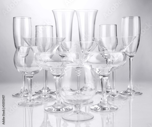 Cocktail and wine glasses, on gray background
