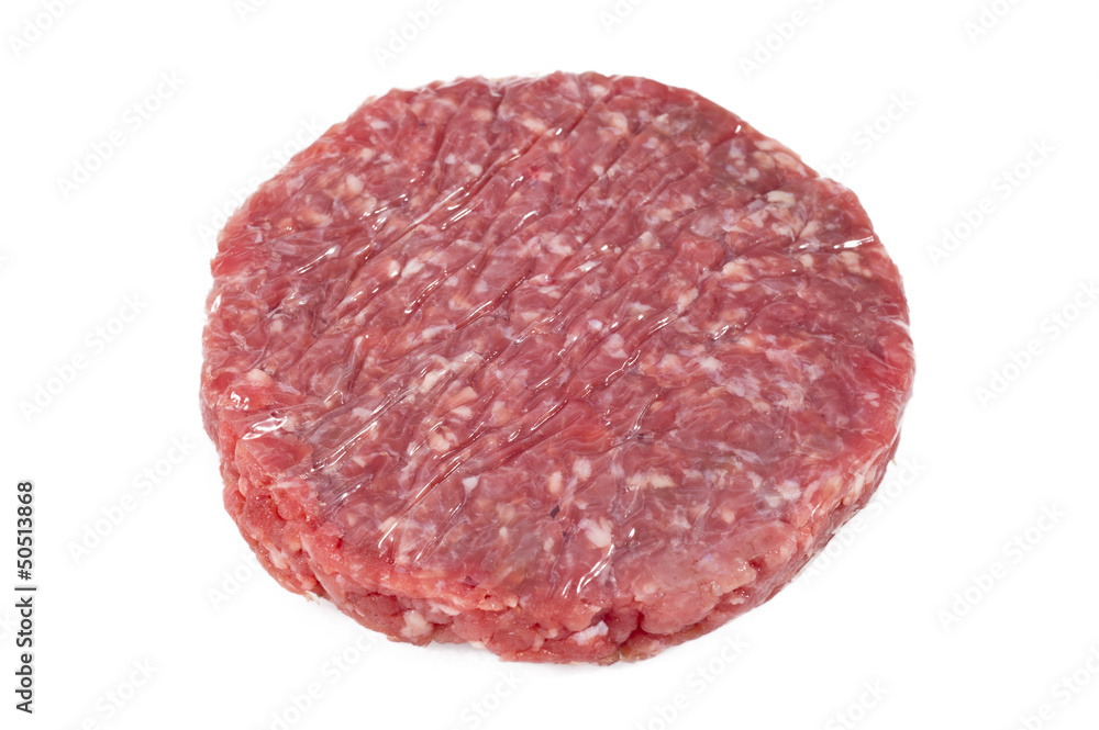 raw hamburgers with protective film raw hamburgers with protective film