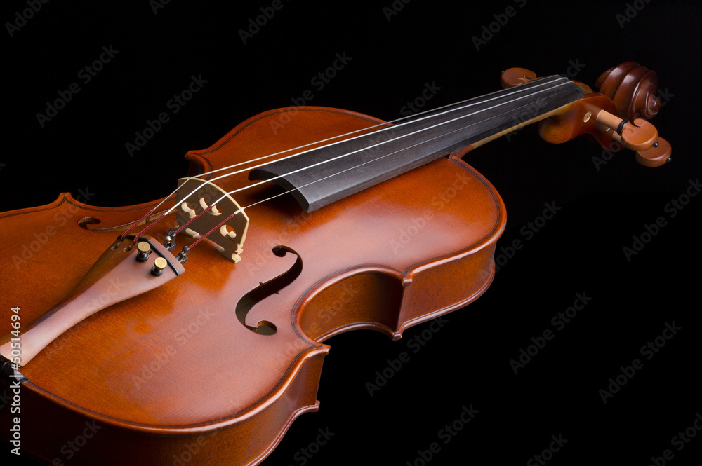 Obraz premium beautiful wooden vintage violin isolated on black background