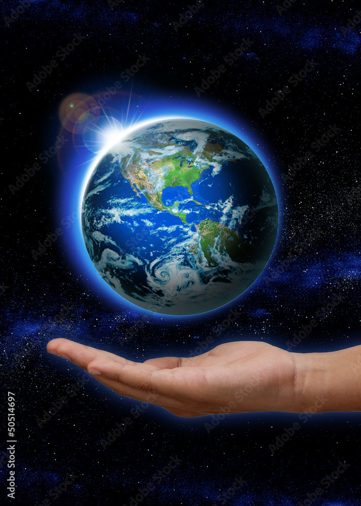 Hand holding Rising Sun over the world, Planet earth in space Hand holding Rising Sun over the world, Planet earth in space