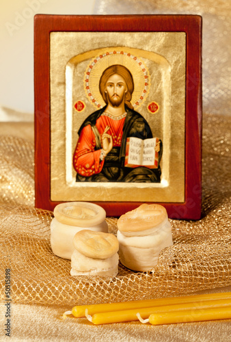 Icon of Christ and religion bread  Hosts and candles photo