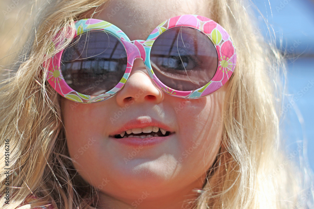 Cute little blonde girl wearing sunglasses Cute little blonde girl wearing sunglasses