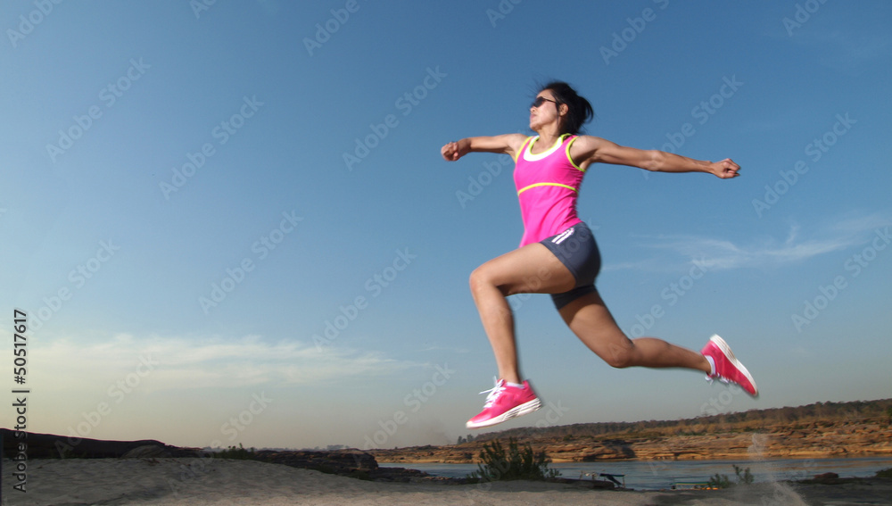 Woman running on the rocky road Woman running on the rocky road