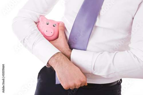 Businessman holding a piggy bank. photo