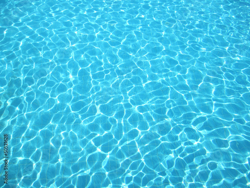 Clear blue water in swimming pool photo