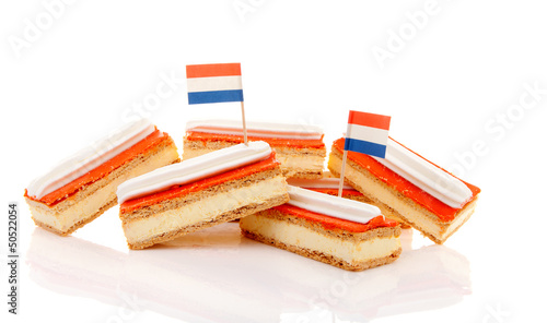 Pile of traditional Dutch pastry called tompouce with flags