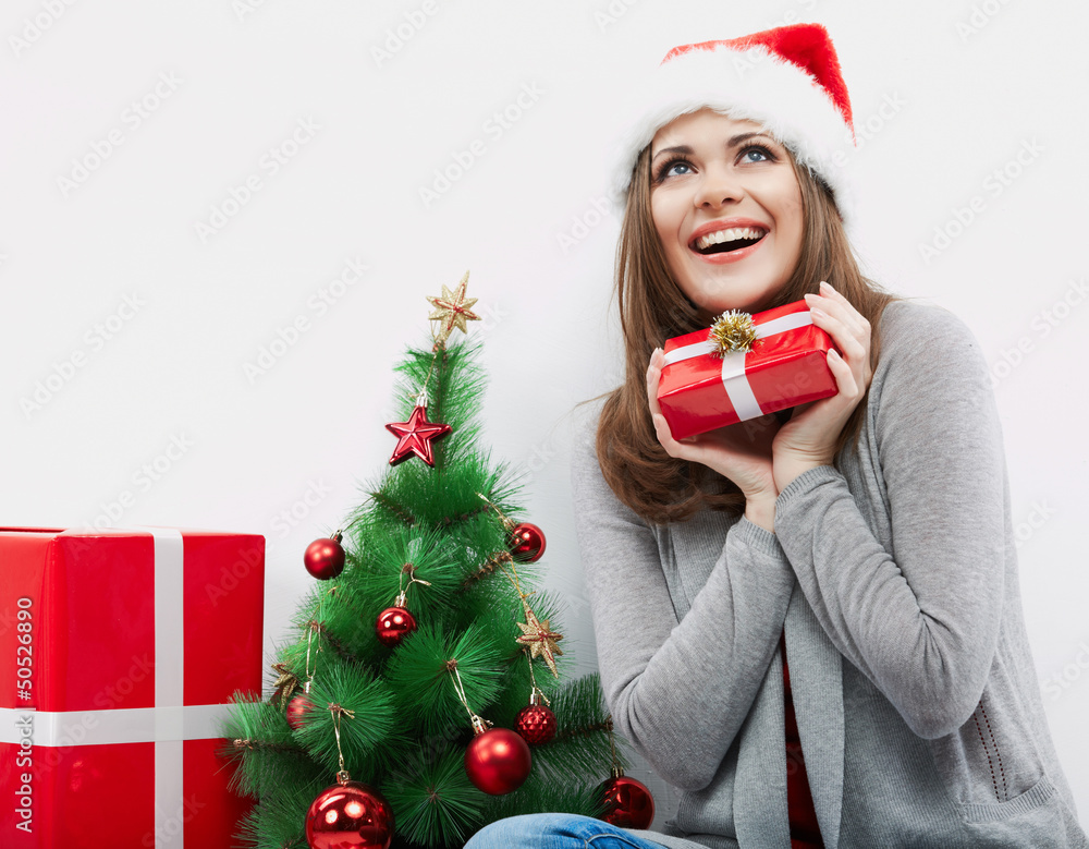 Christmas Santa hat isolated woman portrait hold christmas gift. Christmas Santa hat isolated woman portrait hold christmas gift.
