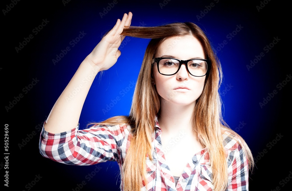 Girl with nerd glasses holding her hair Girl with nerd glasses holding her hair
