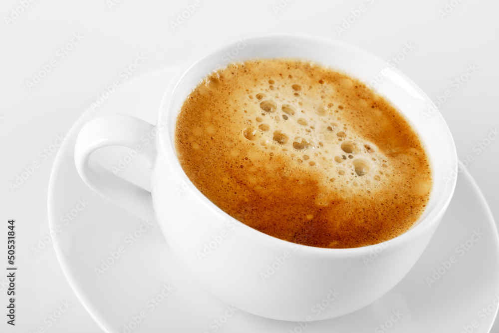 A cup of delicious espresso coffee on a white background A cup of delicious espresso coffee on a white background