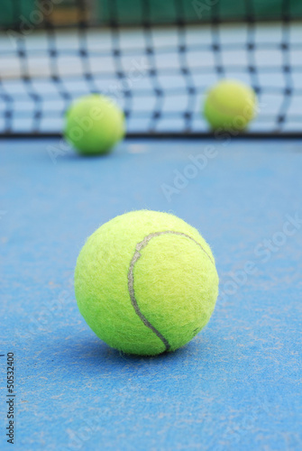 tennis balls on court field