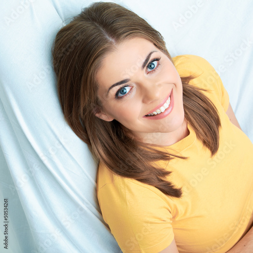 Portrait of woman lying on sofa