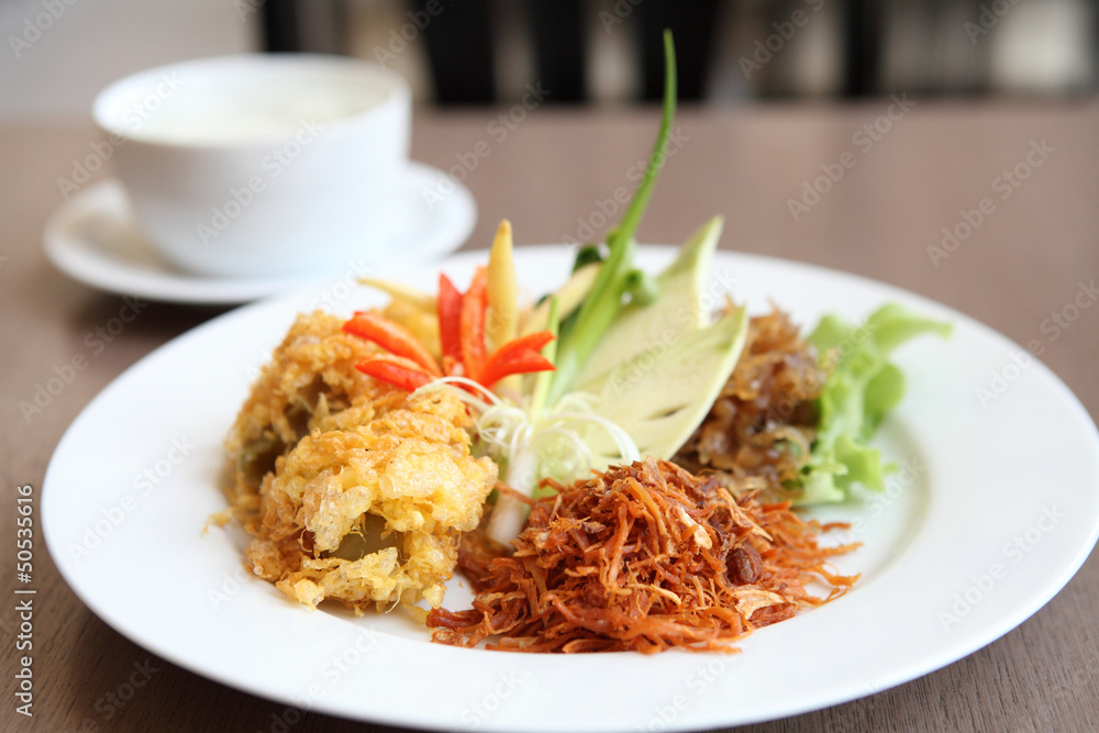Jusmine rice in iced water such deep fried pork, onion, chili. A Jusmine rice in iced water such deep fried pork, onion, chili. A