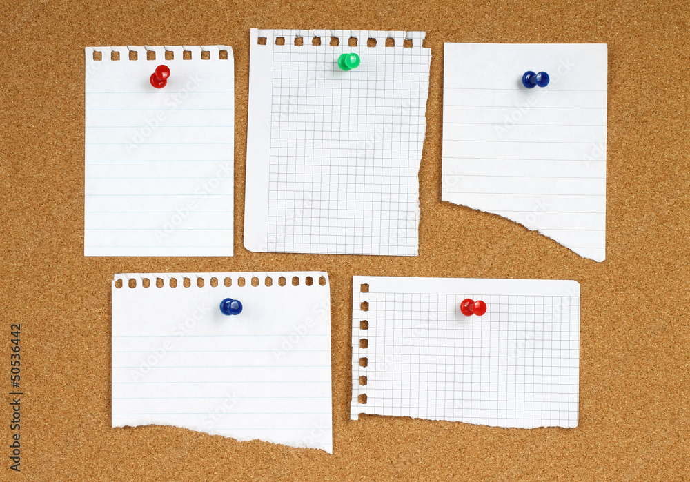 White notes with pin on wooden background . White notes with pin on wooden background .