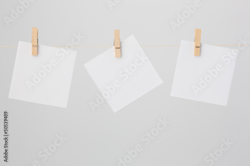 Three White Notes with Clothespins