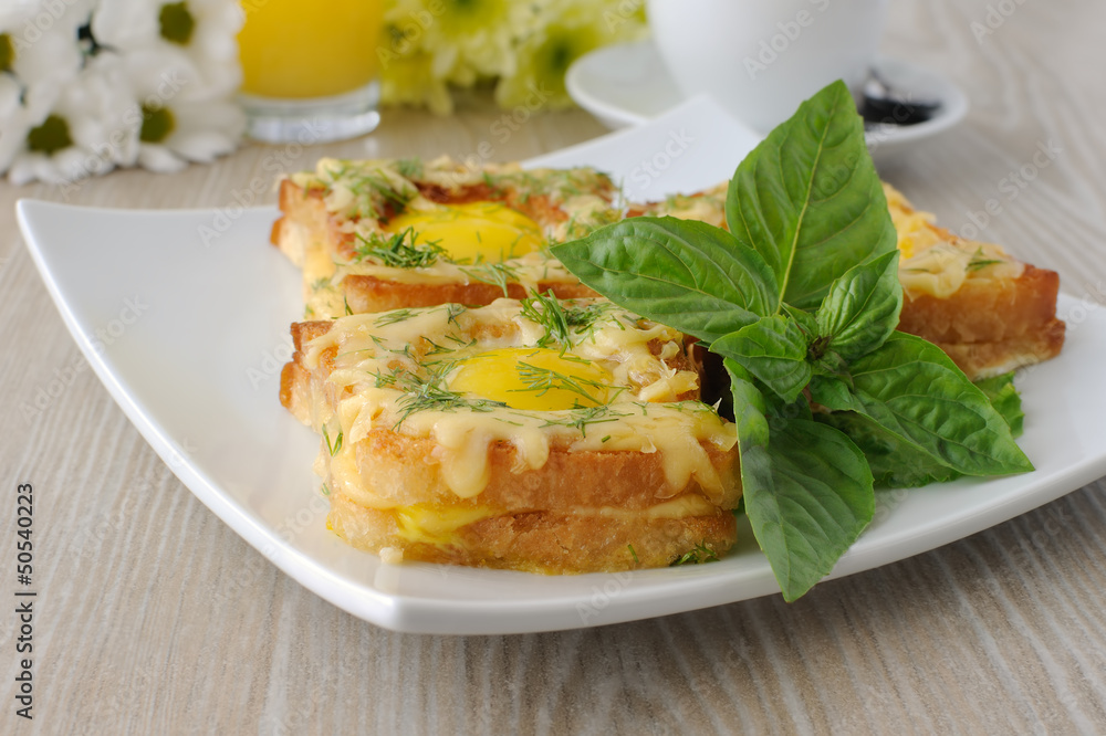 Toast with egg and cheese with dill