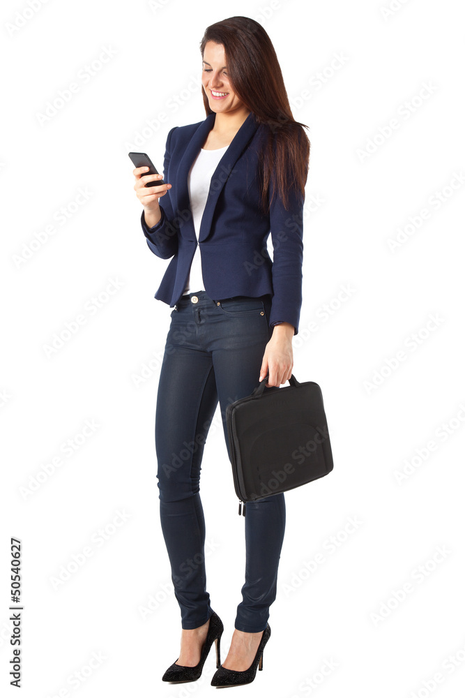 Beautiful businesswoman sending a message on smartphone Beautiful businesswoman sending a message on smartphone