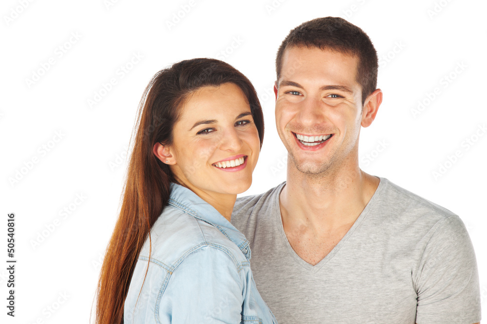 Cheerful young couple standing on white background Cheerful young couple standing on white background