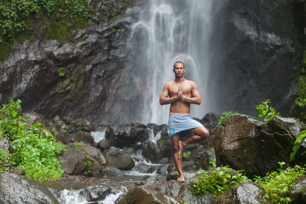 Handsome man at waterfall