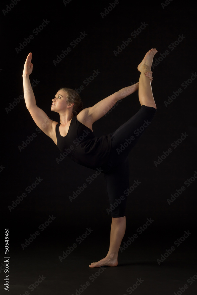 Beautiful, Fit Woman Performing Yoga Pose Beautiful, Fit Woman Performing Yoga Pose