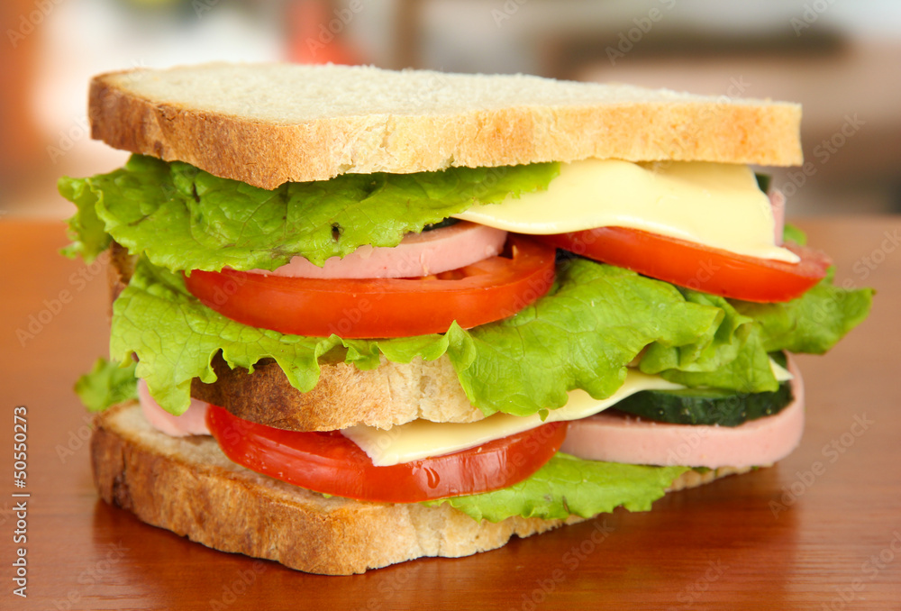 Tasty sandwich on table in cafe
