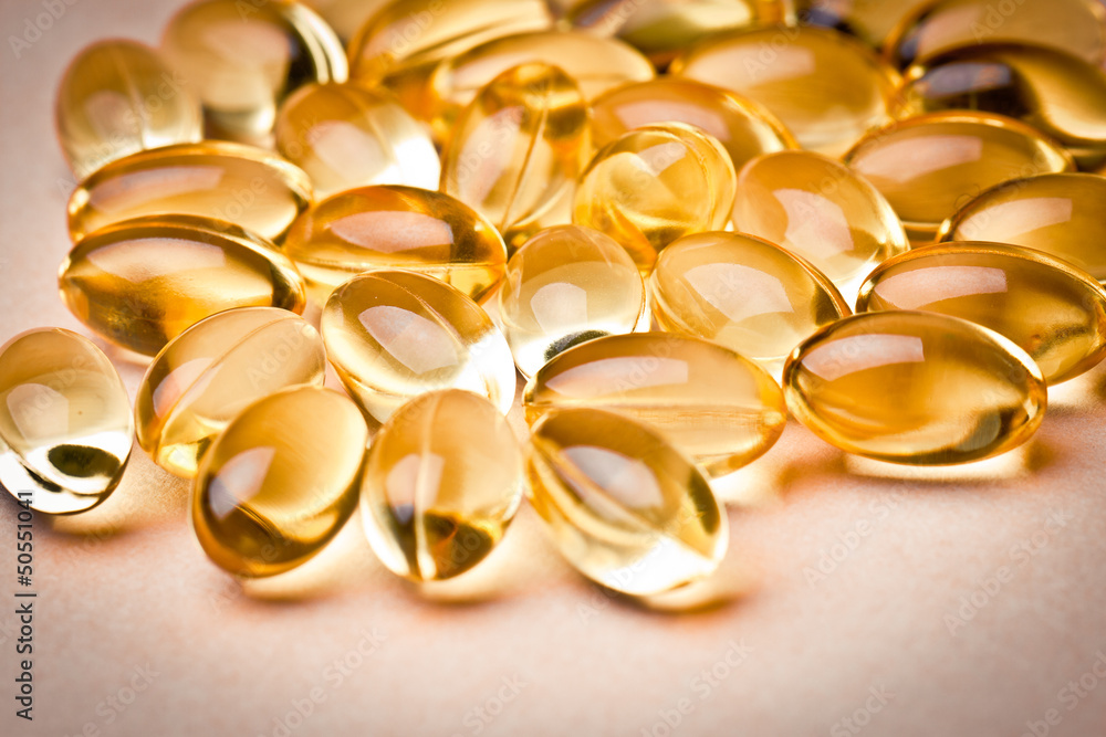 Cod liver oil omega 3 gel capsules isolated on white background Cod liver oil omega 3 gel capsules isolated on white background